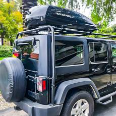 Black rooftop cargo box on off-road vehicle roof